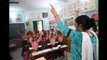 Teachers of Jiamau Primary School doing duty with black band on arms to protest against digital attendance. (HT) Teachers of Jiamau Primary School doing duty with black band on arms to protest against digital attendance. (HT)