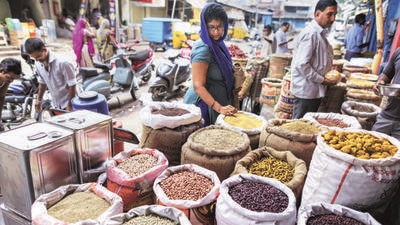 A customer shops for pulses in a store at a local market (Bloomberg File) A customer shops for pulses in a store at a local market (Bloomberg File)