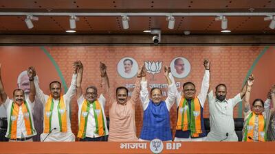 AAP MLA Kartar Singh Tanwar and former minister Raj Kumar Anand join the BJP in the presence of senior leaders at the party headquarters in Delhi on Wednesday. (PTI) AAP MLA Kartar Singh Tanwar and former minister Raj Kumar Anand join the BJP in the presence of senior leaders at the party headquarters in Delhi on Wednesday. (PTI)