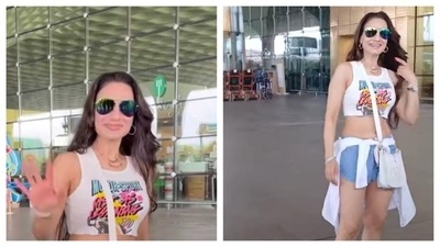 Ameesha Patel is slaying her airport look and setting killer fitness goals. In a graphic crop top, denim shorts with a shirt tied around, Ameesha's proving age is just a number and serving glamour is eternal. (Instagram/@manav.manglani) Ameesha Patel is slaying her airport look and setting killer fitness goals. In a graphic crop top, denim shorts with a shirt tied around, Ameesha's proving age is just a number and serving glamour is eternal. (Instagram/@manav.manglani)