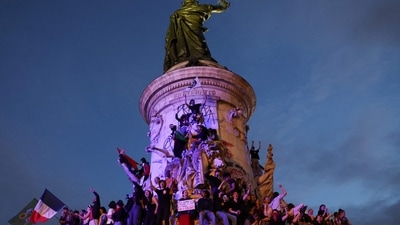 Participants wave French national tricolors during an election night rally following the first results of the second round of France's legislative election at Place de la Republique in Paris on July 7, 2024. (Photo by Emmanuel Dunand / AFP) Participants wave French national tricolors during an election night rally following the first results of the second round of France's legislative election at Place de la Republique in Paris on July 7, 2024. (Photo by Emmanuel Dunand / AFP)