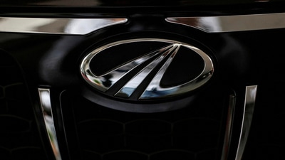 Mahindra & Mahindra share price: The logo of Mahindra and Mahindra is seen on a car at a showroom in Mumbai, India. (Reuters)