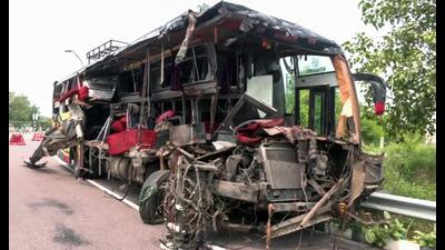 Mangled remains of the bus after it collided with a milk container on Lucknow-Agra Expressway, in Unnao on Wednesday. (ANI Photo)