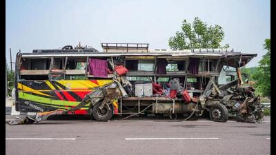 Mangled remains of the bus on a road after the accident, in Unnao district, Wednesday. (PTI Photo) Mangled remains of the bus on a road after the accident, in Unnao district, Wednesday. (PTI Photo)