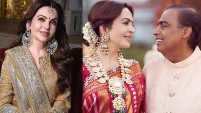 Nita Ambani with her husband Mukesh Ambani Nita Ambani with her husband Mukesh Ambani