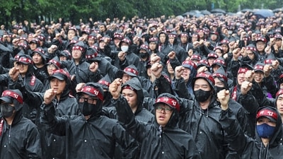 Members of the National Samsung Electronics Union shout slogans during a rally as they began a three-day general strike outside of Samsung Electronics' Hwaseong campus in Hwaseong, South Korea. (AP) Members of the National Samsung Electronics Union shout slogans during a rally as they began a three-day general strike outside of Samsung Electronics' Hwaseong campus in Hwaseong, South Korea. (AP)