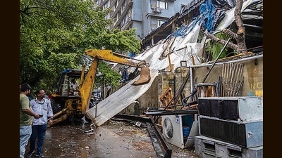 The Brihanmumbai Municipal Corporation (BMC) on Wednesday demolished all unauthorised constructions on the ground floor and terrace of the Vice-Global Tapas Bar at Juhu Tara Road . (Satish Bate/HT Photo) The Brihanmumbai Municipal Corporation (BMC) on Wednesday demolished all unauthorised constructions on the ground floor and terrace of the Vice-Global Tapas Bar at Juhu Tara Road . (Satish Bate/HT Photo)