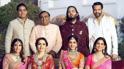 Mukesh Ambani, Nita Ambani, Isha Ambani, Anand Piramal, Anant Ambani, Radhika Merchant, Shloka Mehta and Akash Ambani pose for a family photo during pre-wedding celebrations of Anant and Radhika in Jamnagar in March. Mukesh Ambani, Nita Ambani, Isha Ambani, Anand Piramal, Anant Ambani, Radhika Merchant, Shloka Mehta and Akash Ambani pose for a family photo during pre-wedding celebrations of Anant and Radhika in Jamnagar in March.