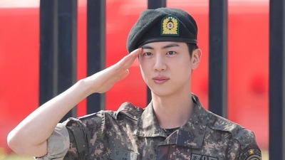 BTS' member Jin saluted after being discharged from military service in June. (AP) BTS' member Jin saluted after being discharged from military service in June. (AP)