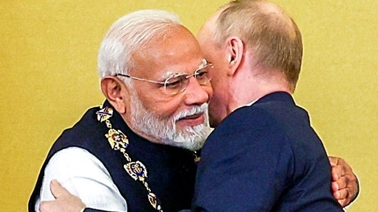 Prime Minister Narendra Modi embraces Russian President Vladimir Putin (ANI)