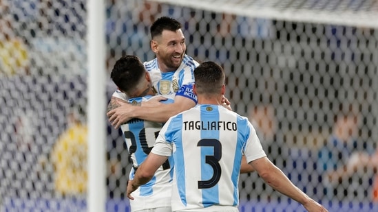 Argentina's Lionel Messi is congratulated after scoring his side's second goal against Canada during a Copa America semifinal(AP)