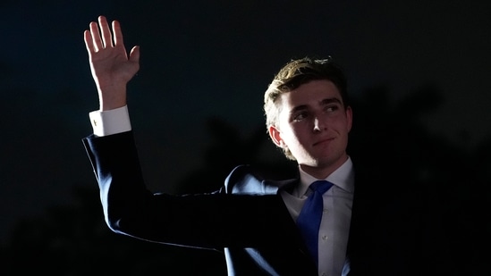 Barron Trump waves as his father, Republican presidential candidate former President Donald Trump, speaks at a campaign rally at Trump National Doral Miami, Tuesday, July 9, 2024, in Doral, Fla. (AP Photo/Rebecca Blackwell)(AP)