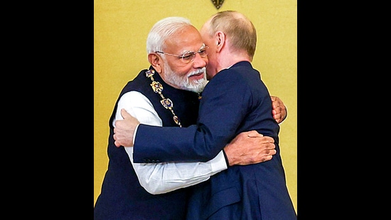 Moscow, Jul 10 (ANI): Prime Minister Narendra Modi embraces Russian President Vladimir Putin after receiving the Order of St Andrew the Apostle the First-Called, Russia's highest civilian honour, at St Catherine's Hall, in Moscow on Tuesday. (ANI Photo) (ANI)
