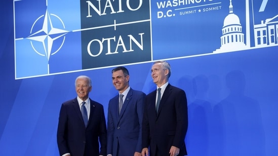 US President Joe Biden, from left, Pedro Sanchez, Spain's prime minister, and Jens Stoltenberg, secretary general of the North Atlantic Treaty Organization (NATO), participate in a welcome handshake during the NATO Summit in Washington, DC, US, on Wednesday, July 10, 2024.(Bloomberg)
