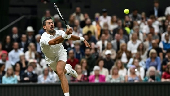 Serbia's Novak Djokovic returns the ball to Denmark's Holger Rune during their men's singles tennis match on the eighth day of the 2024 Wimbledon Championships(AFP)