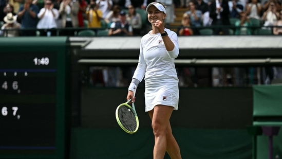 Czech Republic's Barbora Krejcikova celebrates winning against Latvia's Jelena Ostapenko during their women's singles quarter-finals tennis match on the tenth day of the 2024 Wimbledon Championships(AFP)