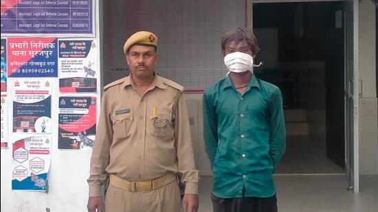 The 18-year-old man in police custody on Wednesday. (HT Photo) The 18-year-old man in police custody on Wednesday. (HT Photo)