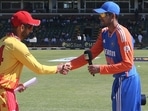 India's Shubman Gill (R) shakes hands with Zimbabwe's Sikandar Raza (L) after winning the toss and electing to bat 