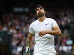 Carlos Alcaraz reacts during a match.