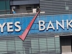The logo of Yes Bank is pictured on the facade of its headquarters in Mumbai.