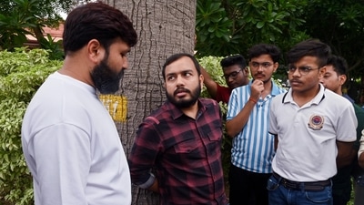 Founder of Physics Wallah Alakh Pandey waits outside with students as the hearing is going on regarding the alleged irregularities in NEET UG 2024 in the Supreme Court in New Delhi on Monday. (ANI) Founder of Physics Wallah Alakh Pandey waits outside with students as the hearing is going on regarding the alleged irregularities in NEET UG 2024 in the Supreme Court in New Delhi on Monday. (ANI)