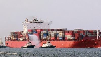 Tugboats offer water salute to MV San Fernando as they steer the mothership from China, through the breakwater channel to the Vizhinjam International Seaport, in Thiruvananthapuram on Thursday. (ANI) Tugboats offer water salute to MV San Fernando as they steer the mothership from China, through the breakwater channel to the Vizhinjam International Seaport, in Thiruvananthapuram on Thursday. (ANI)