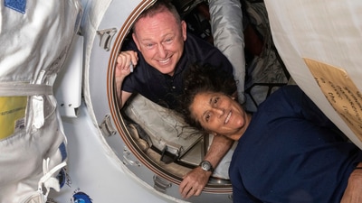 In this photo provided by NASA, Boeing Crew Flight Test astronauts Butch Wilmore, left, and Suni Williams pose for a portrait inside the vestibule between the forward port on the International Space Station's Harmony module and Boeing's Starliner spacecraft on June 13, 2024. (NASA via AP) (AP) In this photo provided by NASA, Boeing Crew Flight Test astronauts Butch Wilmore, left, and Suni Williams pose for a portrait inside the vestibule between the forward port on the International Space Station's Harmony module and Boeing's Starliner spacecraft on June 13, 2024. (NASA via AP) (AP)
