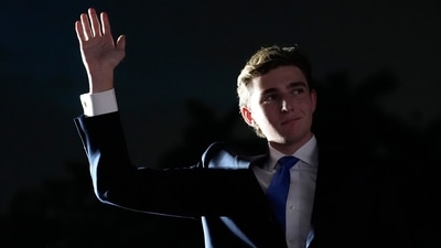 Barron Trump waves as his father, Republican presidential candidate former President Donald Trump, speaks at a campaign rally at Trump National Doral Miami, Tuesday, July 9, 2024, in Doral, Fla. (AP/Rebecca Blackwell)