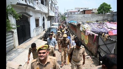 LDA team along with other departments marking the houses during a survey at Abrar Nagar area on Thursday. (Deepak Gupta /HT Photo)