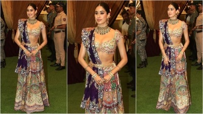 Janhvi Kapoor looked absolutely stunning in an Anamika Khanna lehenga. Her ensemble featured a bralette blouse adorned with vibrant multi-colour embroidery, paired with a matching skirt and a contrasting purple dupatta. Styled with heavy jewellery, she radiated effortless glamour. (HT photo/VarinderChawla) Janhvi Kapoor looked absolutely stunning in an Anamika Khanna lehenga. Her ensemble featured a bralette blouse adorned with vibrant multi-colour embroidery, paired with a matching skirt and a contrasting purple dupatta. Styled with heavy jewellery, she radiated effortless glamour. (HT photo/VarinderChawla)