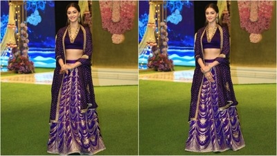 Ananya Panday dazzles in a purple lehenga by Raw Mango. Her elegant outfit features a V-neckline blouse with golden detailing, paired with a matching skirt and an exquisite dupatta draped gracefully around her shoulders. (HT photo/VarinderChawla) Ananya Panday dazzles in a purple lehenga by Raw Mango. Her elegant outfit features a V-neckline blouse with golden detailing, paired with a matching skirt and an exquisite dupatta draped gracefully around her shoulders. (HT photo/VarinderChawla)
