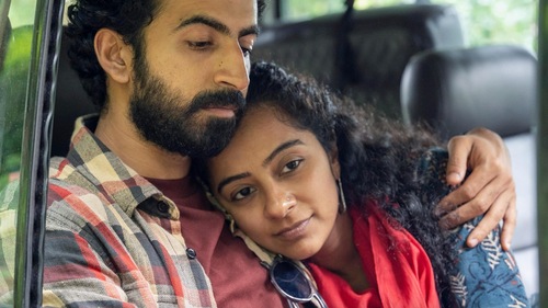 Roshan Mathew and Darshana Rajendran in a still from the movie. (IMDb) Roshan Mathew and Darshana Rajendran in a still from the movie. (IMDb)