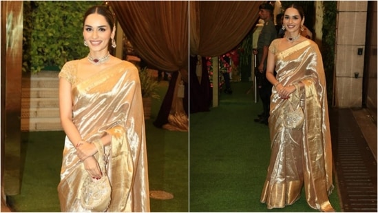 Manushi Chhillar embodies grace and elegance in a regal six yards of grace. Her stunning gold silk saree was draped to let the pallu cascade beautifully down her shoulder. Styled with a choker necklace and a potli bag, she sets fashion goals with effortless charm.(HT photo/VarinderChawla)
