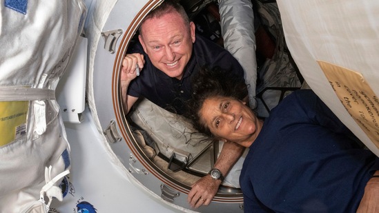 In this photo provided by NASA, Boeing Crew Flight Test astronauts Butch Wilmore, left, and Suni Williams pose for a portrait inside the vestibule between the forward port on the International Space Station's Harmony module and Boeing's Starliner spacecraft on June 13, 2024. (NASA via AP)(AP) In this photo provided by NASA, Boeing Crew Flight Test astronauts Butch Wilmore, left, and Suni Williams pose for a portrait inside the vestibule between the forward port on the International Space Station's Harmony module and Boeing's Starliner spacecraft on June 13, 2024. (NASA via AP)(AP)