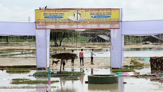 Hathras India - July 04 2024: People looking towards the pandal at the spot after the incident at Hathras Sikandra Rao Satya Sangh. in Hathras , India on Thursday, July 04 2024. (Photo by Sakib Ali/Hindustan Times)