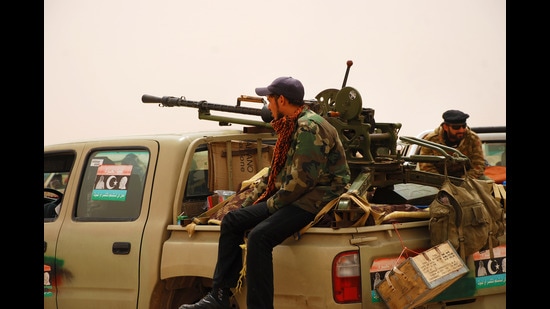 Libyan rebels travelling to a battle line where they will fight Colonel Muammar Gaddafi’s army in a picture dated April 7, 2011. (Rosen Ivanov Iliev/ Shutterstock)