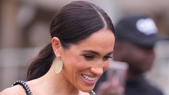 Meghan Markle allegedly went on at least 13 foreign holidays despite accusing royals of taking her passport away (AP Photo/Sunday Alamba)(AP)