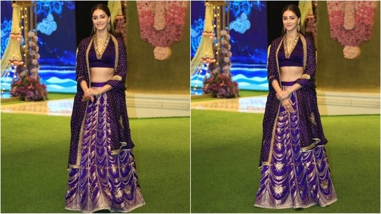 Ananya Panday dazzles in a purple lehenga by Raw Mango. Her elegant outfit features a V-neckline blouse with golden detailing, paired with a matching skirt and an exquisite dupatta draped gracefully around her shoulders.(HT photo/VarinderChawla)