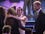 Meghan Markle, center and Prince Harry, right, arrive at the ESPY awards on Thursday, July 11, 2024, at the Dolby Theatre in Los Angeles. (AP Photo/Mark J. Terrill)