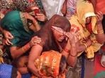 Relatives mourn the death of a victim in the stampede that occured during a religious congregation in Hathras on July 3. (PTI Photo) Relatives mourn the death of a victim in the stampede that occured during a religious congregation in Hathras on July 3. (PTI Photo)
