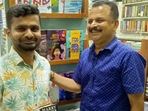 Reese Thomas with Devadas (R), the owner of the book shop from where he stole a copy of JK Rowling's Harry Potter when he was a student. Reese Thomas with Devadas (R), the owner of the book shop from where he stole a copy of JK Rowling's Harry Potter when he was a student.