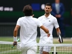 Serbia's Novak Djokovic shakes hands with Italy's Lorenzo Musetti after winning their semi final match