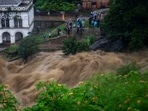 People watch the flooded Bagmati river in Kathmandu, Nepal, Saturday, July 6, 2024. People watch the flooded Bagmati river in Kathmandu, Nepal, Saturday, July 6, 2024.
