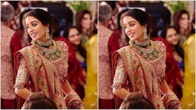 With the help of hair stylist Amit Thakur, Radhika styled her luscious tresses into a middle-parted braided hairdo adorned with golden embellishments, adding a touch of royal elegance to her look. (Instagram) With the help of hair stylist Amit Thakur, Radhika styled her luscious tresses into a middle-parted braided hairdo adorned with golden embellishments, adding a touch of royal elegance to her look. (Instagram)