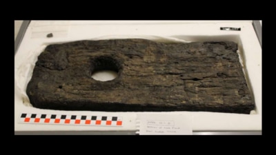 A bit of the oak-wood walkway found in Glastonbury, dating to 3800 BCE. It was a short walkway meant to make it easier to roll wheeled carts across a bog. (Picture courtesy British Museum)