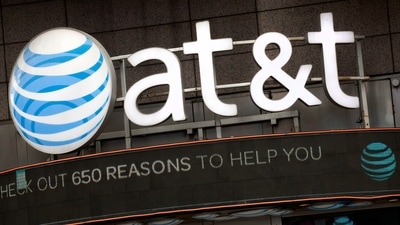 The AT&T logo is positioned above one of its retail stores in New York, Oct. 24, 2016. (AP Photo/Mark Lennihan, File) (AP) The AT&T logo is positioned above one of its retail stores in New York, Oct. 24, 2016. (AP Photo/Mark Lennihan, File) (AP)