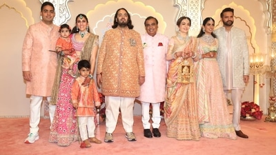Anant Ambani and the rest of the Ambani family posed for the media at the wedding venue. Anant Ambani and the rest of the Ambani family posed for the media at the wedding venue.