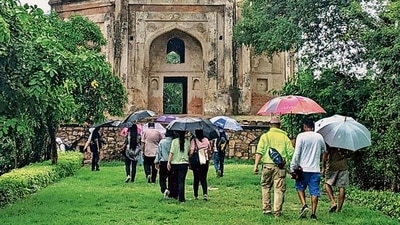 Walking enthusiasts combine heritage with flora, amid the lush greens of Mehrauli, during a photowalk in Delhi.