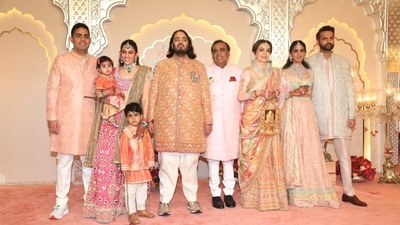 Mukesh Ambani, Akash Ambani, Shloka Ambani, Anand Piramal and Isha Ambani decked up in pastel outfits. 