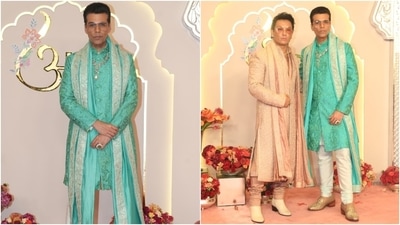 Karan Johar wore a Tiffany blue embroidered bandhgala sherwani with a shawl and white pants to attend Anant Ambani and Radhika Merchant's wedding. Designer Prabal Gurung accompanied the director. (HT Photo) Karan Johar wore a Tiffany blue embroidered bandhgala sherwani with a shawl and white pants to attend Anant Ambani and Radhika Merchant's wedding. Designer Prabal Gurung accompanied the director. (HT Photo)